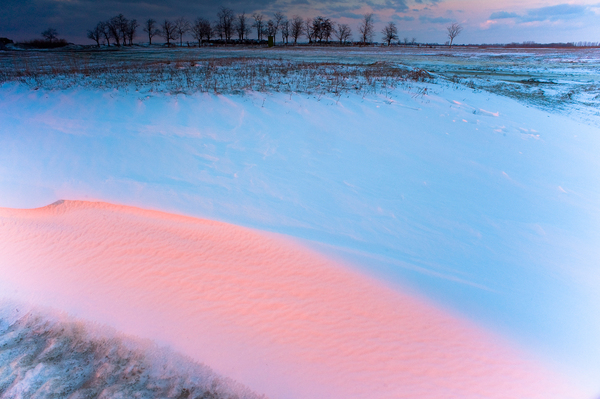 A lemenő nap sugarai megf